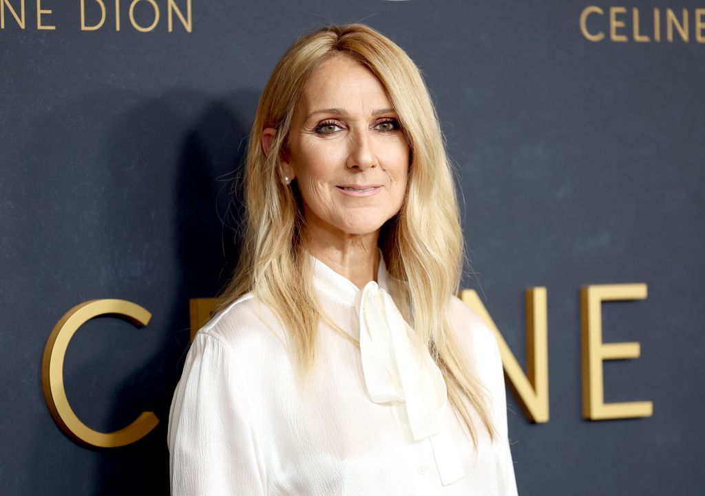 celine dion wearing white and smiling a documentary premiere