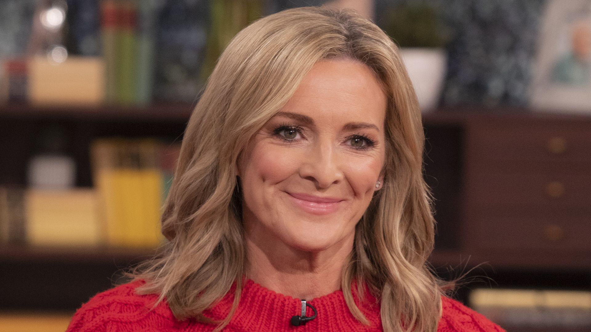 Gabby Logan on This Morning sofa in red jumper