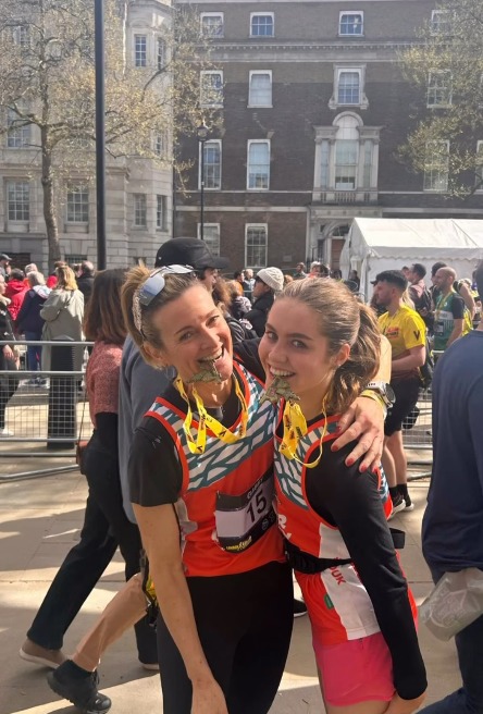 Gabby and Lois logan in sporting gear with medals