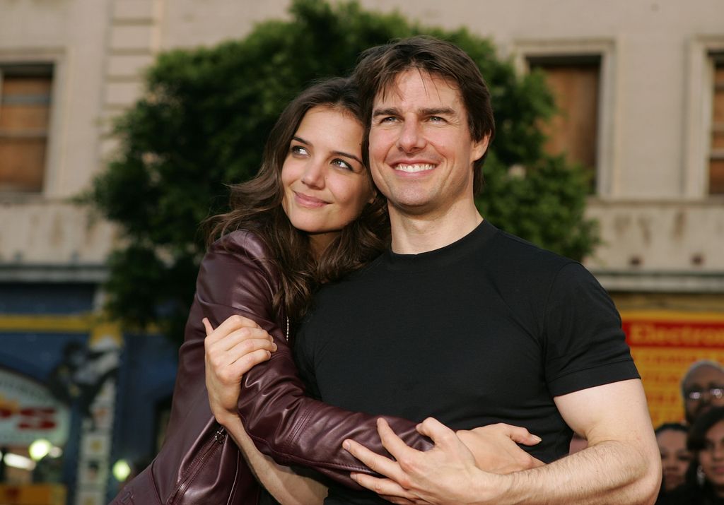 HOLLYWOOD - JUNE 27: Actor Tom Cruise (R) and actress Katie Holmes arrive at the Los Angeles Fan Screening of "War of the Worlds" at the Grauman's Chinese Theatre on June 27, 2005 in Hollywood, California. (Photo by Kevin Winter/Getty Images)